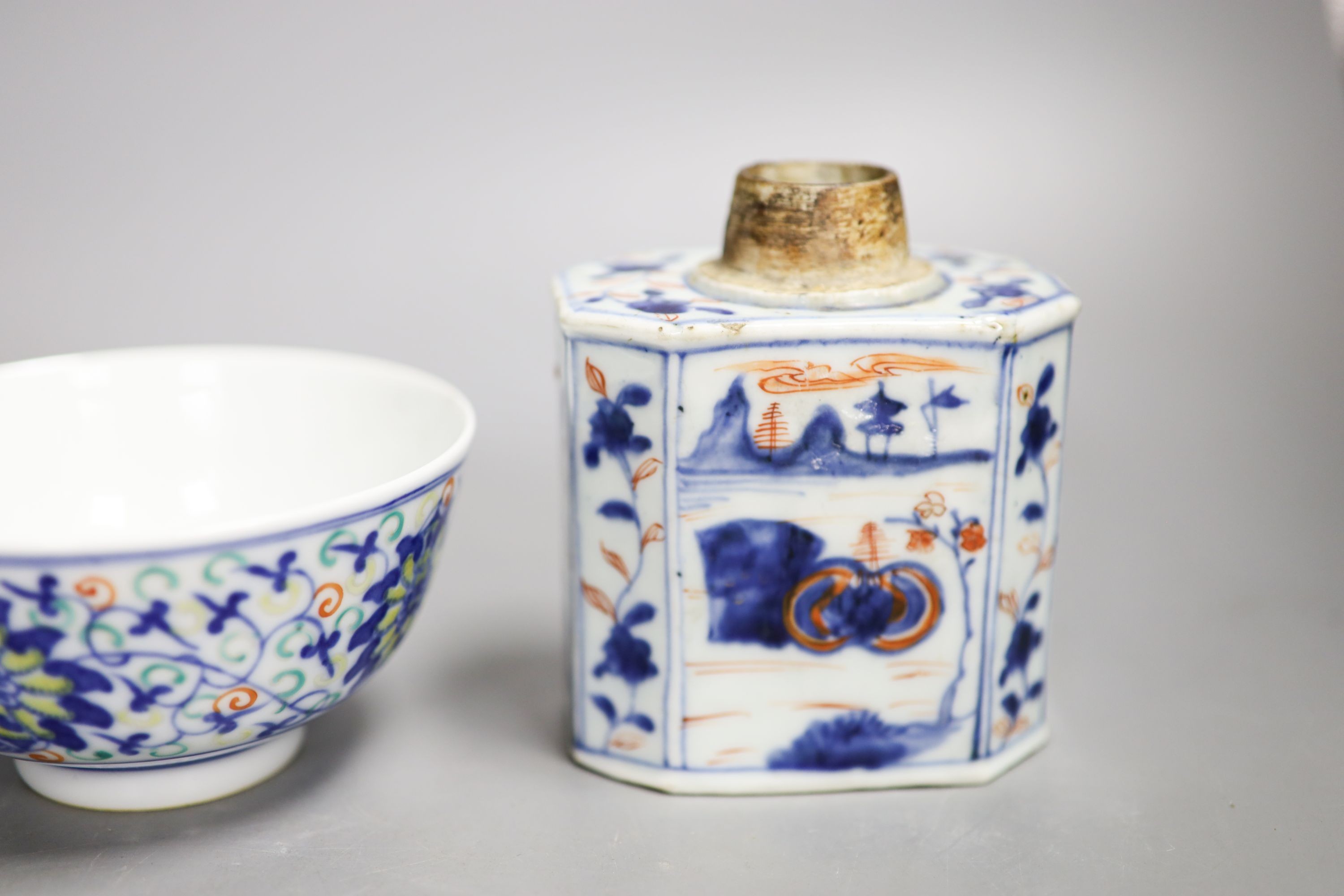 A Chinese famille rose mug, a Chinese Imari tea caddy and a doucai bowl, 18th century and later